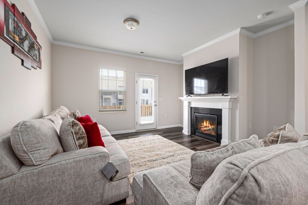 Cozy living room with fireplace in a Triad NC home for sale