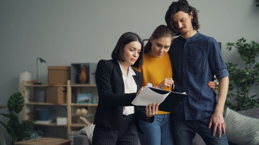 Young couple consulting with a real estate agent